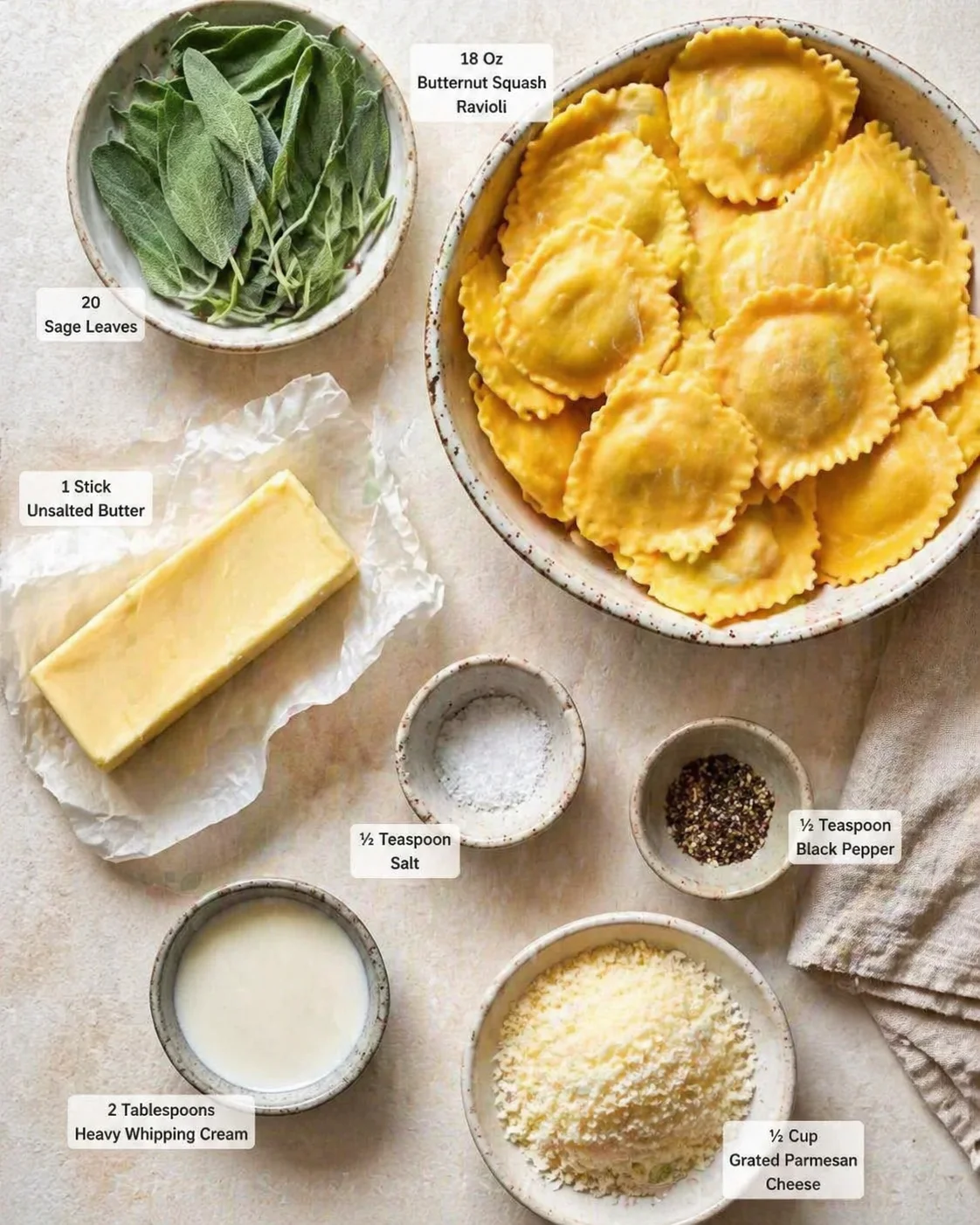 Measured ingredients arranged for Delicious and Creamy Butternut Squash Ravioli Sauce Recipe: 18 Oz Butternut Squash Ravioli, 20 Sage Leaves, 1 Stick Unsalted Butter, ½ Teaspoon Salt, ½ Teaspoon Black Pepper, 2 Tablespoo
