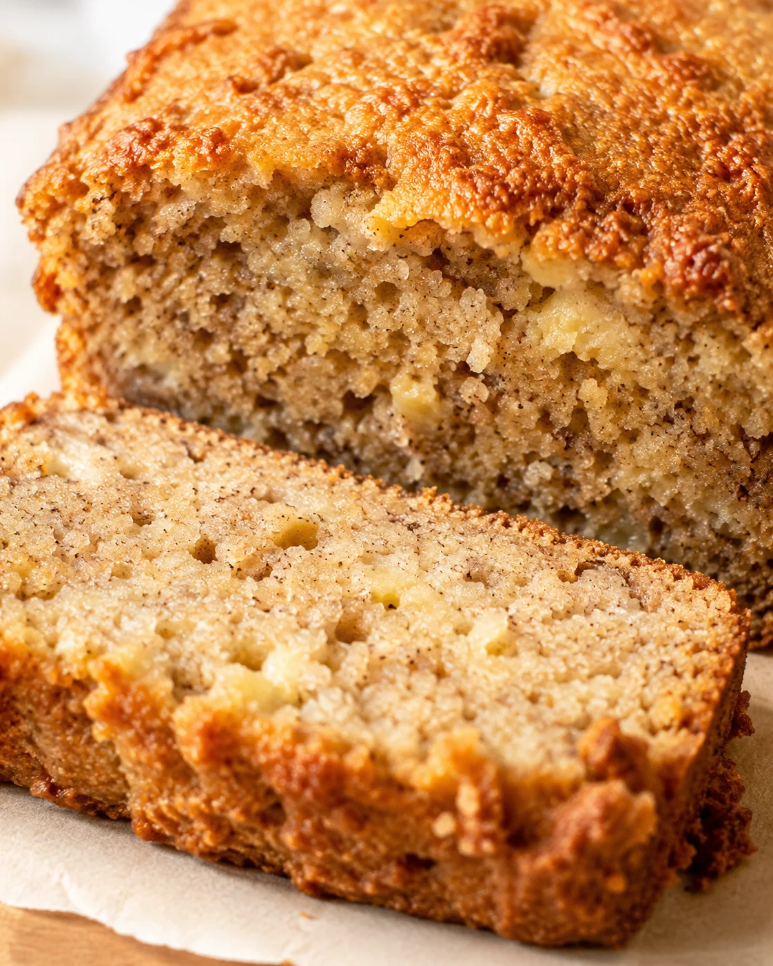 close-up of banana bread with a golden crust and crumbly streusel topping