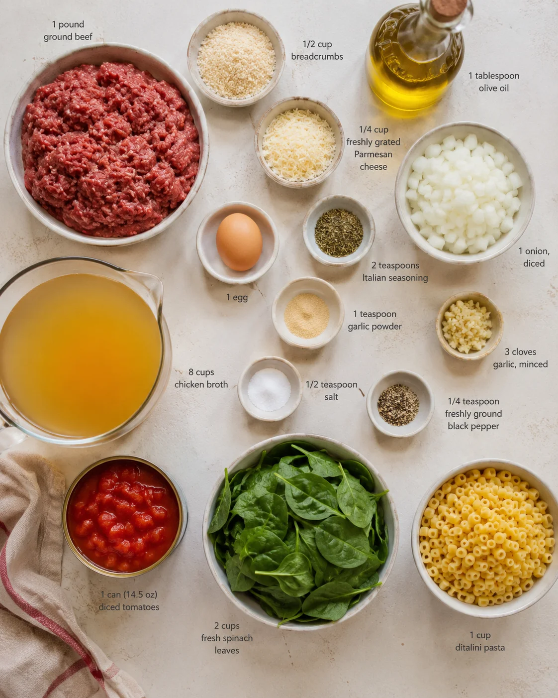 top-down view of ingredients for Italian wedding soup arranged in bowls and jars with labeled measurements