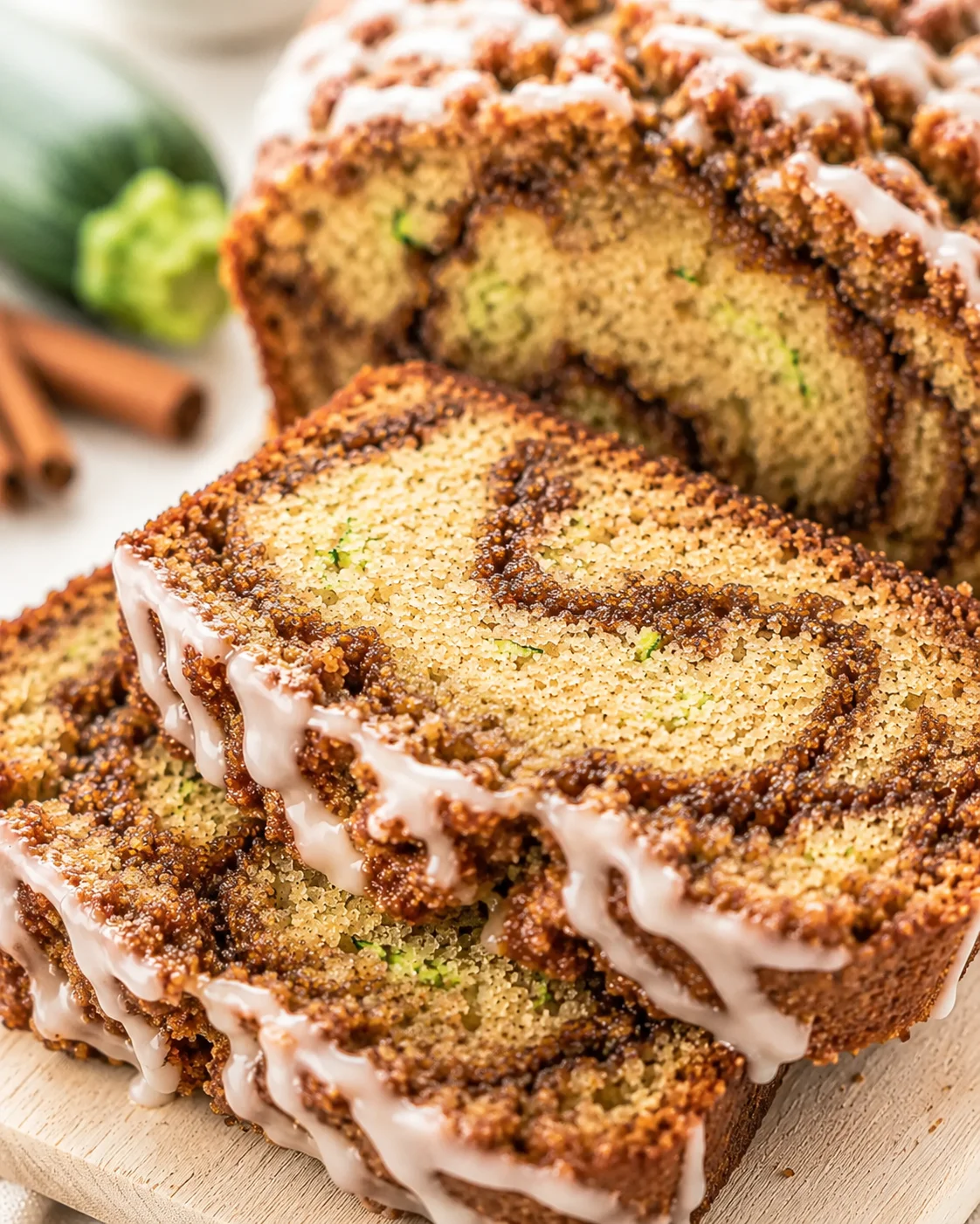 Moist Cinnamon Swirl Zucchini Bread Close-up of sliced cinnamon swirl zucchini bread showing moist interior and swirled cinnamon patterns