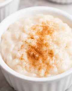 Creamy almond milk rice pudding topped with a sprinkle of cinnamon.
