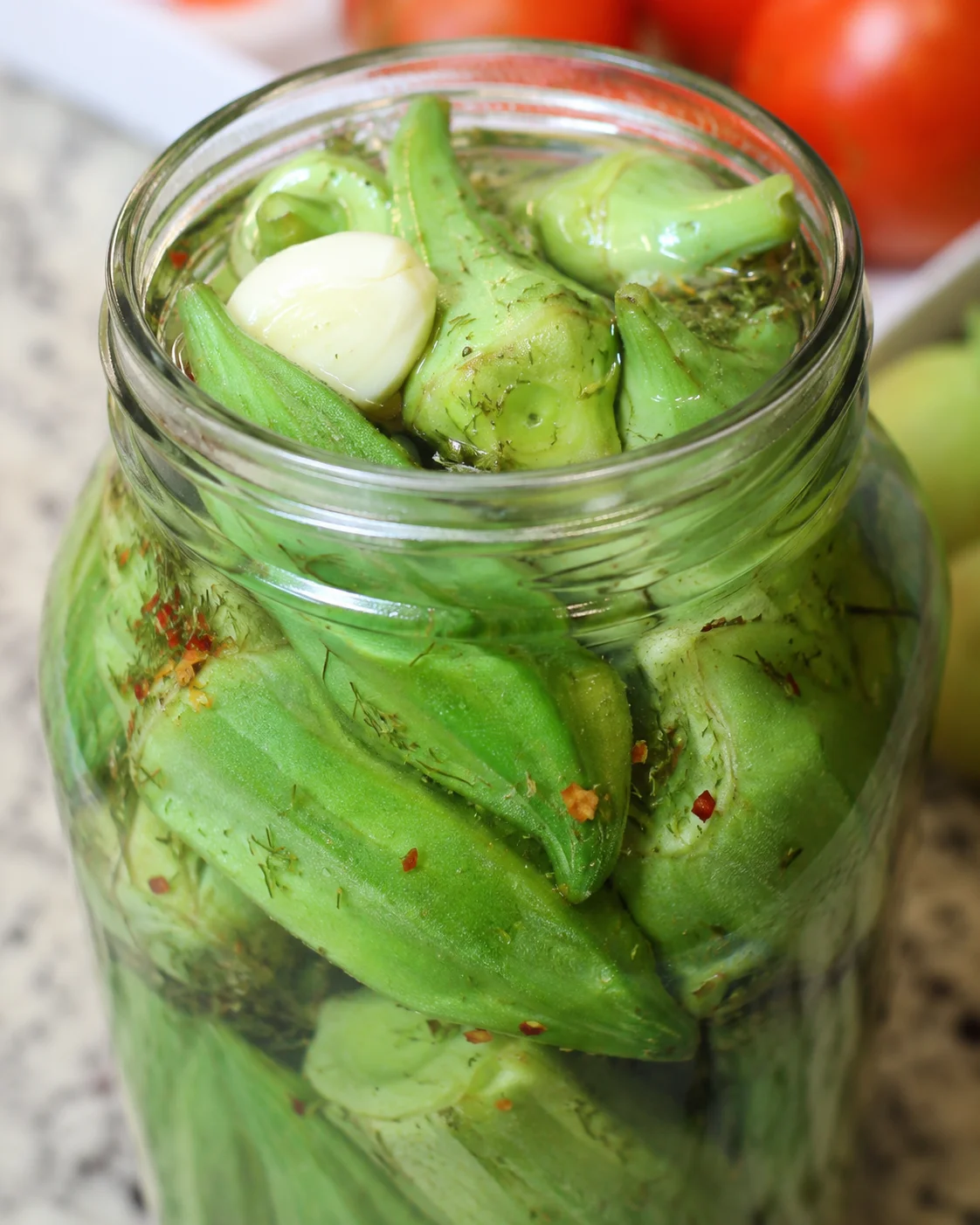 Crunchy and tangy homemade refrigerator pickled okra in a jar.