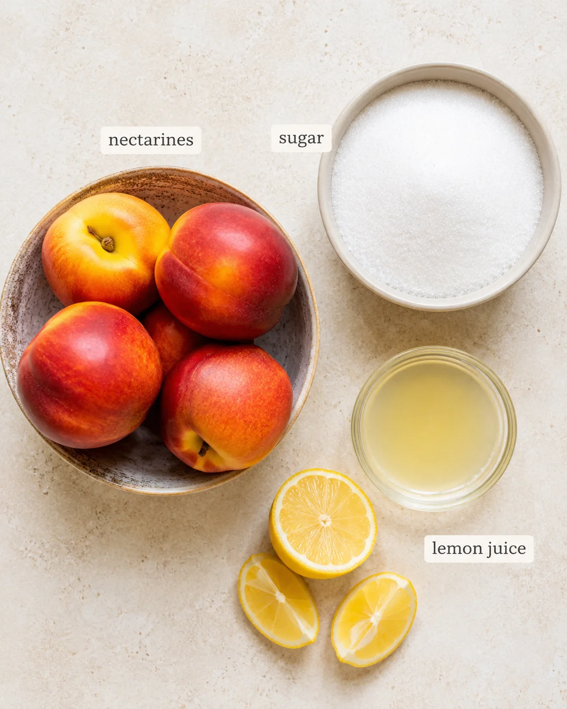 Raw nectarines, sugar, lemon juice and a sliced lemon ready for jam making.