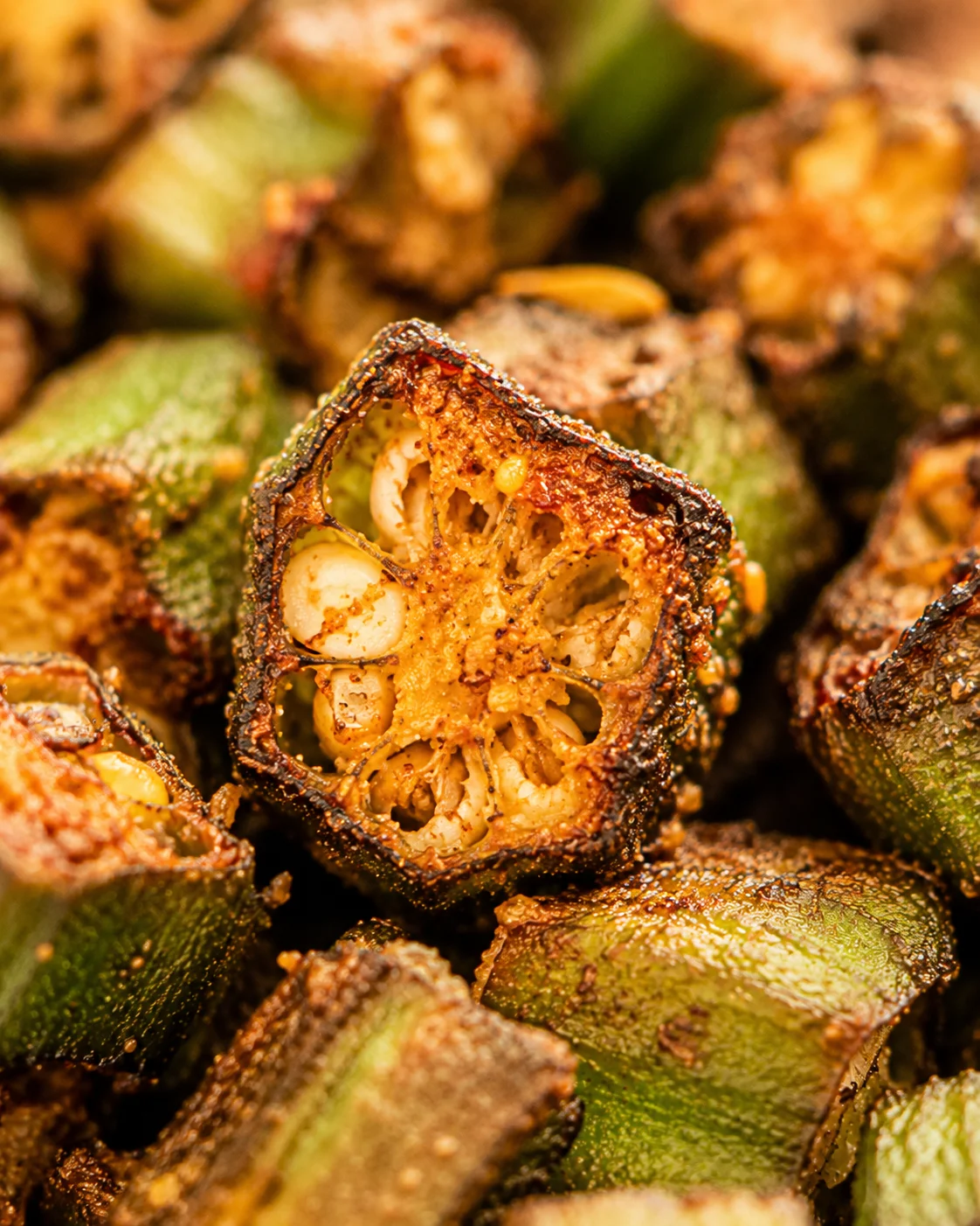 Close-up of crispy roasted okra with smoky, savory flavor and vibrant green color