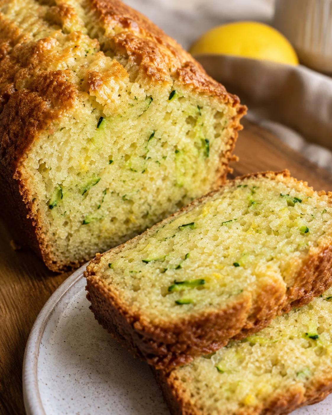 A freshly baked lemon zucchini bread with golden crust and moist inside.