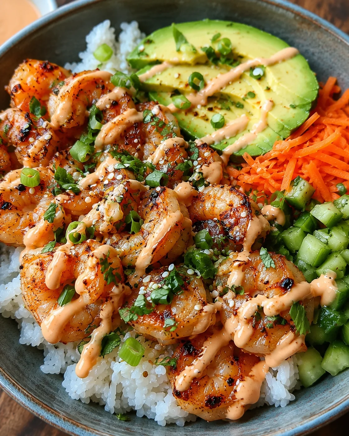 Shrimp Rice Bowls with Spicy Mayo Colorful shrimp rice bowls topped with sliced avocado, carrots, cucumber, and spicy mayo