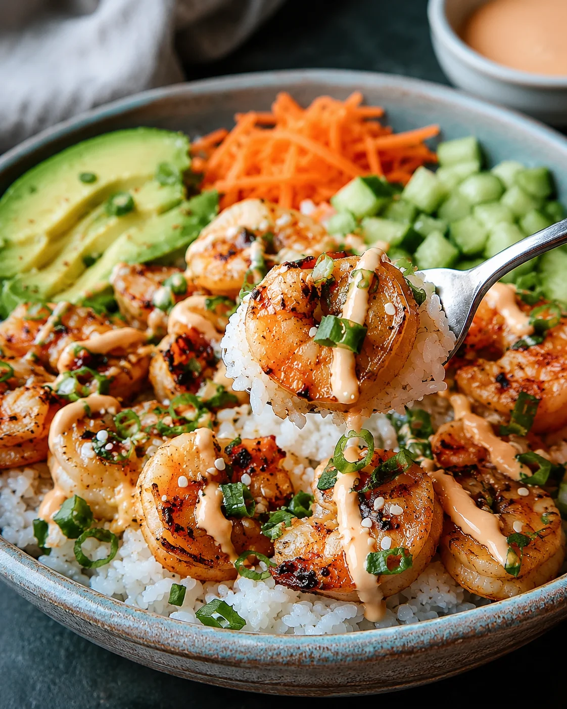 Shrimp Rice Bowls with Spicy Mayo Colorful shrimp rice bowls topped with spicy mayo and fresh vegetables.