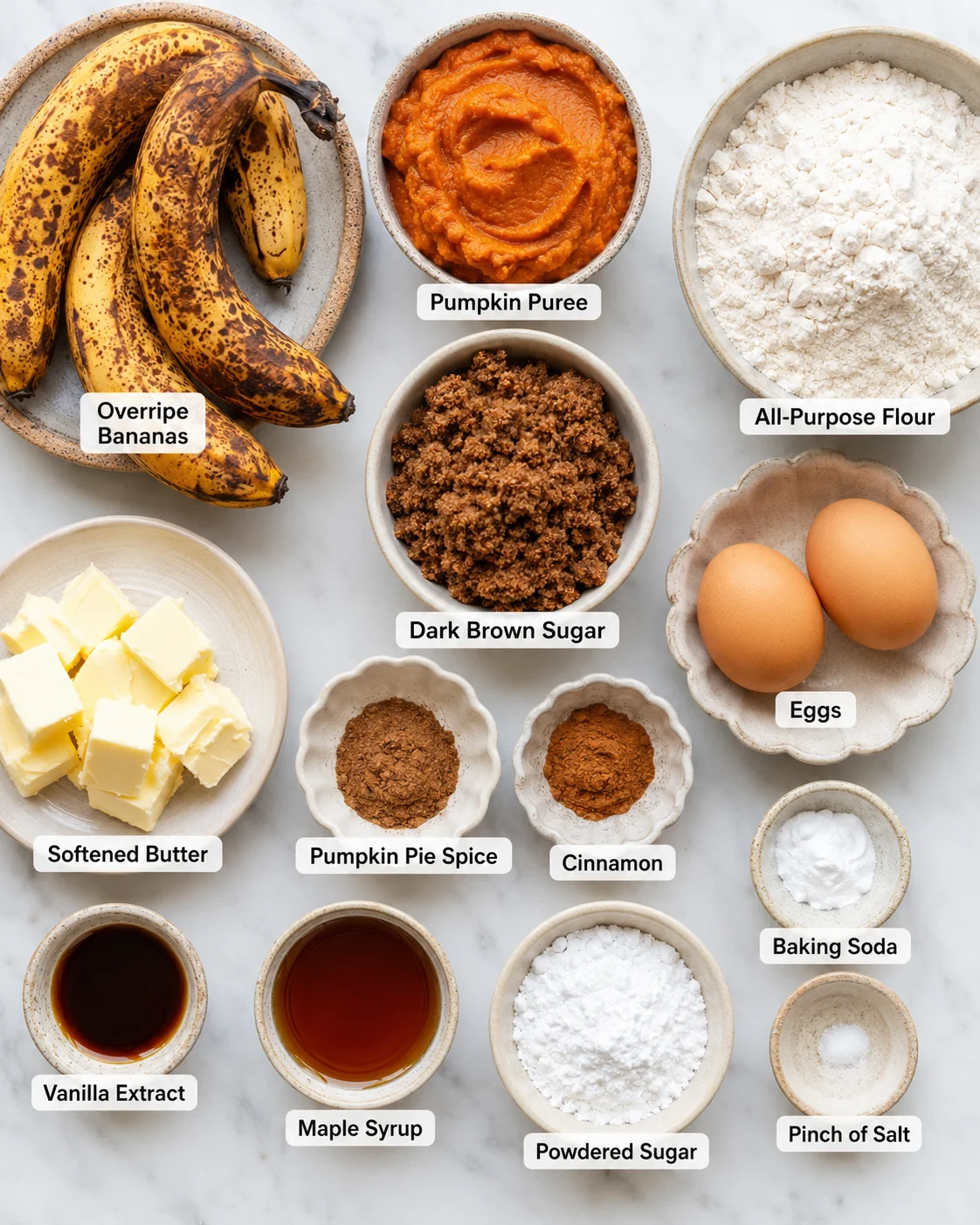 Top-down arrangement of measured ingredients for pumpkin banana bread, including bananas, pumpkin puree, flour and spices