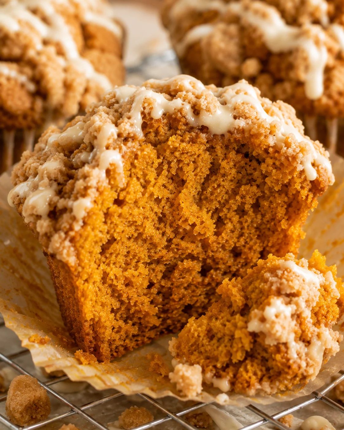 Close-up detail of the interior crumb of a gluten free pumpkin muffin with streusel